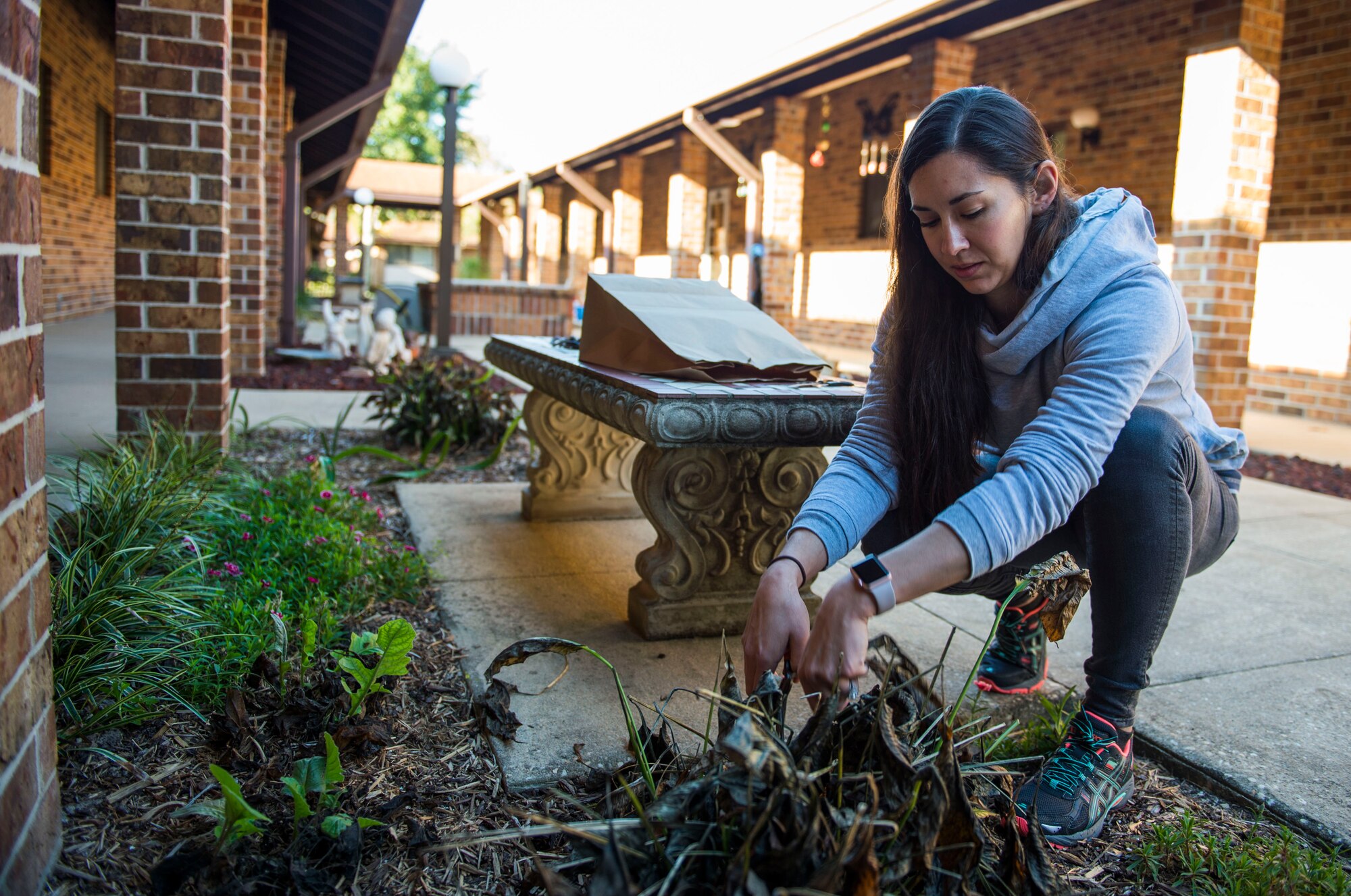 Tech. Sgt. Renee Snavely, an independent duty medical technician with the 1st Special Operations Support Squadron, pulls weeds from a flower bed at the Bob Hope Village in Shalimar, Fla., Feb 2, 2017. The Bob Hope Village is part of the Air Force Enlisted Village, which is a nonprofit organization with a core mission to provide a safe, secure home for surviving spouses of retired enlisted U.S. Airmen. (U.S. Air Force photo by Senior Airman Krystal M. Garrett)