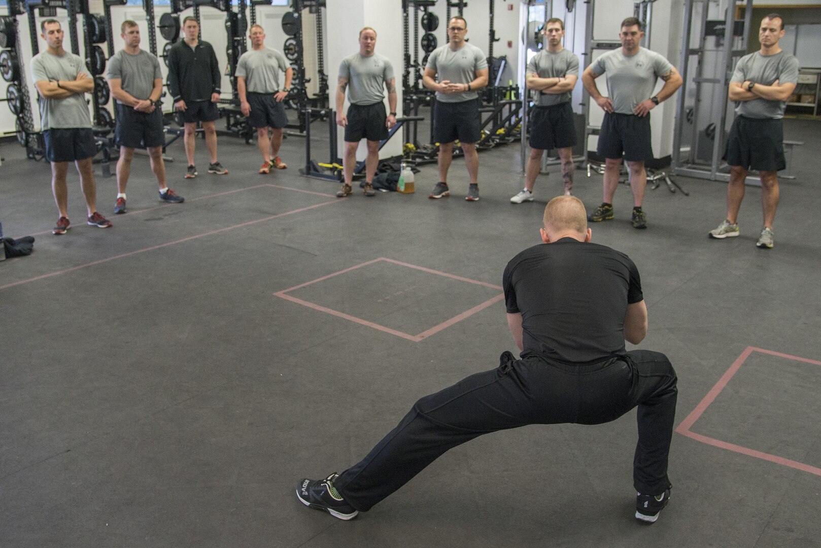 Tim “Red” Wakeham, Michigan State University strength and conditioning coach, demonstrates some manual resistance exercises to help improve Tactical Air Control Party instructors' weight training curriculum about at Joint Base San Antonio-Lackland Medina Annex Feb. 1, 2017. 