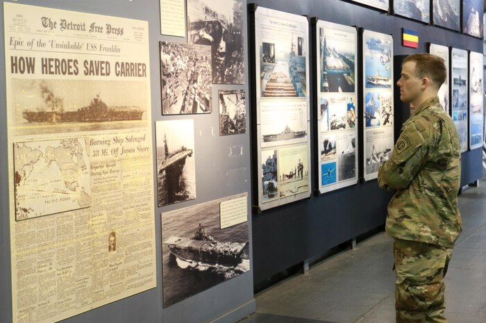 A Paratrooper assigned to 1st Battalion, 505th Parachute Infantry Regiment, 3rd Brigade Combat Team, 82nd Aiborne Division looks at an exhibit aboard the USS Yorktown and Medal of Honor Museum at Charleston, S.C. , Feb. 2, 2017.                The Paratroopers traveled to Charleston to honor and recognize military history and train with U.S. Air Force crewmembers for a training event. (U.S. Army photo by Sgt. Anthony Hewitt)