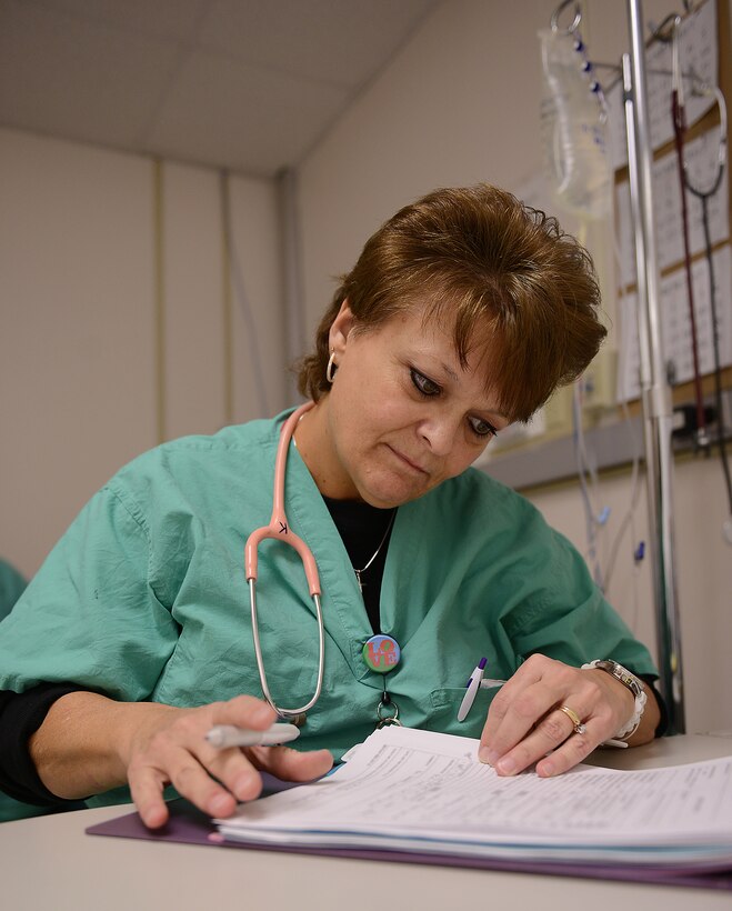 Karen Minetree, McDonald Army Health Center post anesthesia care unit and same day surgery registered nurse, reviews a patient’s chart prior to surgery at Joint Base Langley-Eustis, Va., Jan. 31, 2017. Approximately 150 to 160 surgeries are performed each month at MCAHC. (U.S. Air Force photo by Staff Sgt. Teresa J. Cleveland)