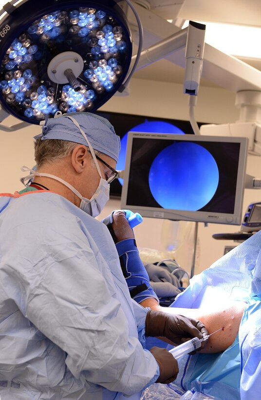 Harry Warren, McDonald Army Health Center orthopedic surgeon, begins a procedure on a patient’s shoulder at Joint Base Langley-Eustis, Va., Jan. 31, 2017. Orthopedic surgeons are able to perform procedures to repair injuries such as meniscus tears, knee or shoulder arthritis, rotator cuff tears and repair fractures. (U.S. Air Force photo by Staff Sgt. Teresa J. Cleveland)