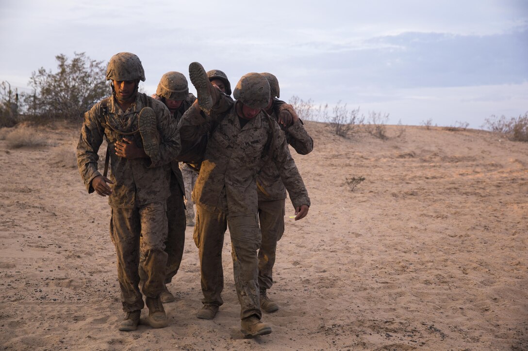 U.S. Marines with 8th Engineer Support Battalion carry a simulated casualty during a squad competition at Cannon Air Defense Complex, Yuma, Ariz., Oct. 24, 2016. Squad competitions happen among every unit throughout the Marine Corps to build camaraderie and Esprit de Corps. (U.S. Marine Corps photo taken by Lance Cpl. Christian Cachola/Released)