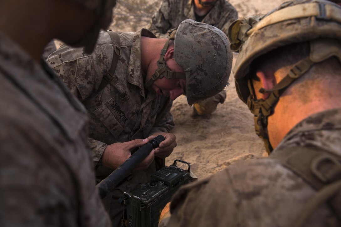 U.S. Marine Corps Lance Cpl. Joshua Syryczuk with 8th Engineer Support Battalion sets up a radio as part of a squad competition at Cannon Air Defense Complex, Yuma, Ariz., Oct. 24, 2016.  Squad competitions happen among every unit throughout the Marine Corps to build camaraderie and Esprit de Corps. (U.S. Marine Corps photo taken by Lance Cpl. Christian Cachola/Released)