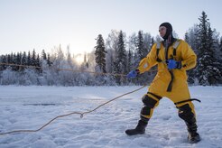 U.S. Air Force Senior Airman Zachary Baldwin, a fire protection specialist assigned to the 673rd Civil Engineer Squadron, recovers a simulated cold water victim while conducting ice water rescue training at Joint Base Elmendorf-Richardson, Alaska Feb. 4, 2017. The training taught the JBER firefighters self-rescue techniques, victim recovery, and certified them as ice water rescue technicians. Baldwin is a native of Alden, N.Y. (U.S. Air Force photo/Alejandro Pena)