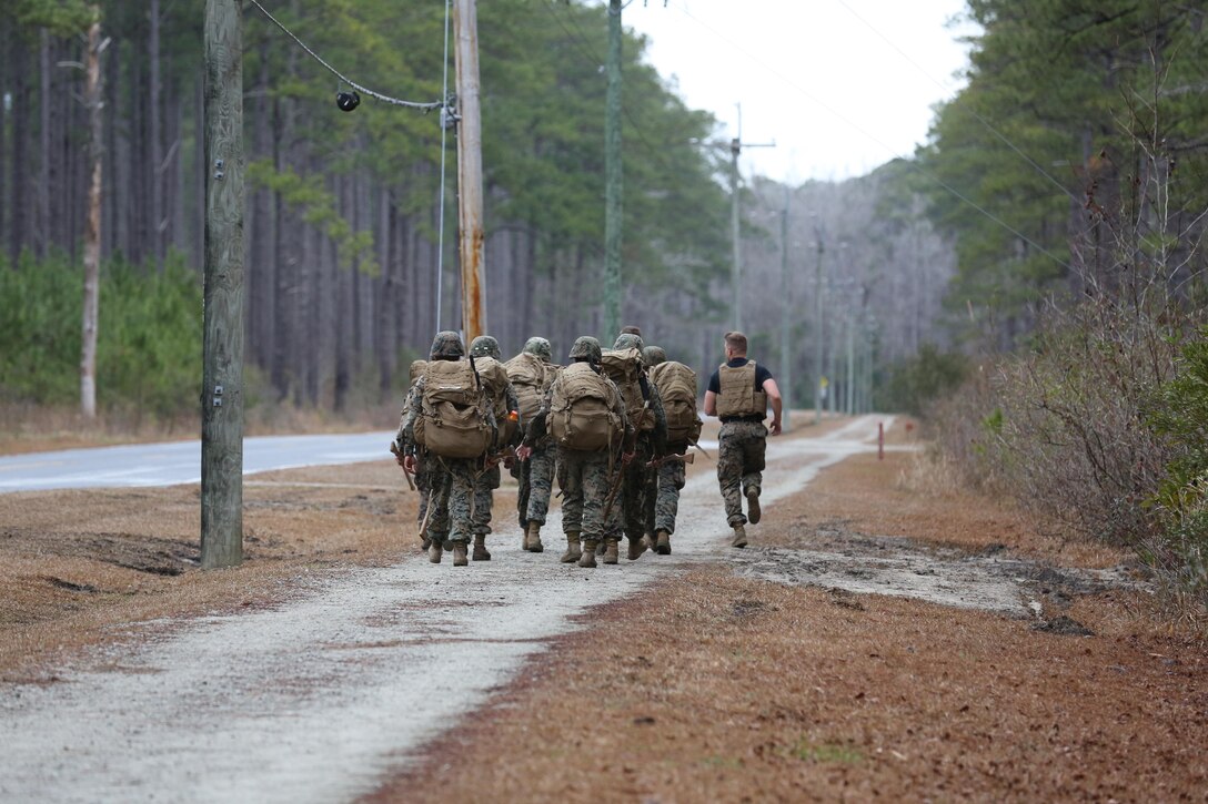 Martial Arts Instructor course students conduct a hike during the course’s culminating event aboard Marine Corps Air Station Cherry Point, N.C., Feb. 3, 2017.The Marines endured three weeks of intense training, including: public speaking, written examinations, practical application of techniques, and how to be a proficient Marine Corps Martial Arts Program Instructor. More than 20 Marines graduated the course. (U.S. Marine Corps photo by Lance Cpl. Cody Lemons/Released)