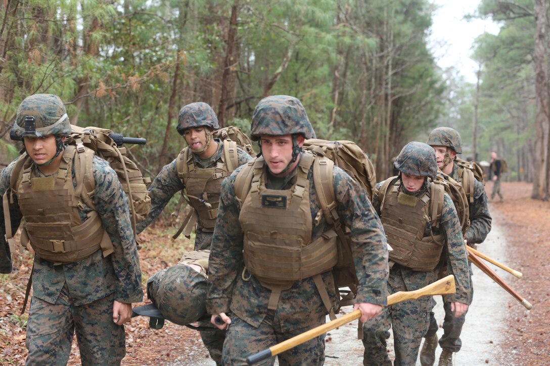 Marines in the Martial Arts Instructor course conduct a notional casualty extract during the course’s culminating event aboard Marine Corps Air Station Cherry Point, N.C., Feb. 3, 2017. The course instills the skills necessary to proficiently instruct the disciplines of the Marine Corps Martial Arts Program to fellow Marines. The Marines endured physically and mentally demanding tasks on their way to graduating and becoming MCMAP instructors. (U.S. Marine Corps photo by Lance Cpl. Cody Lemons/Released)