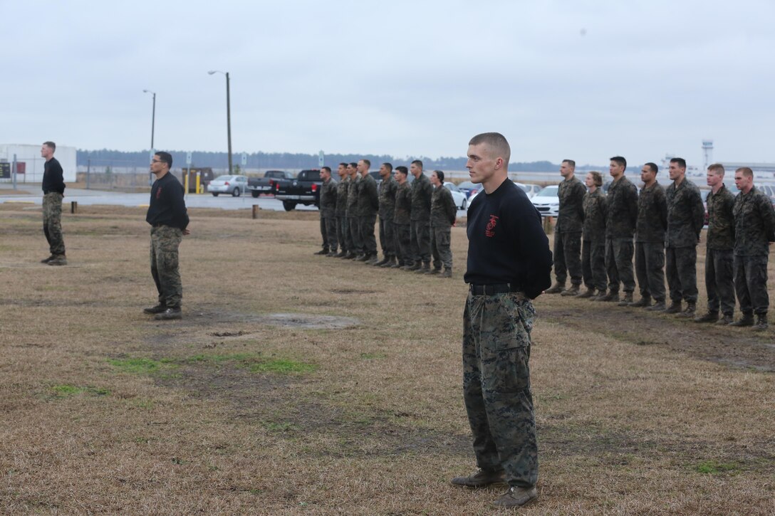 Marines enrolled in the Martial Arts Instructor course stand in formation while they wait to graduate aboard Marine Corps Air Station Cherry Point, N.C., Feb. 3, 2017. More than 20 Marines graduated the strenuous course and were declared Marine Corps Martial Art Program instructors. The course taught the Marines the necessary skills to properly and proficiently instruct MCMAP to fellow Marines. (U.S. Marine Corps photo by Lance Cpl. Cody Lemons/Released)