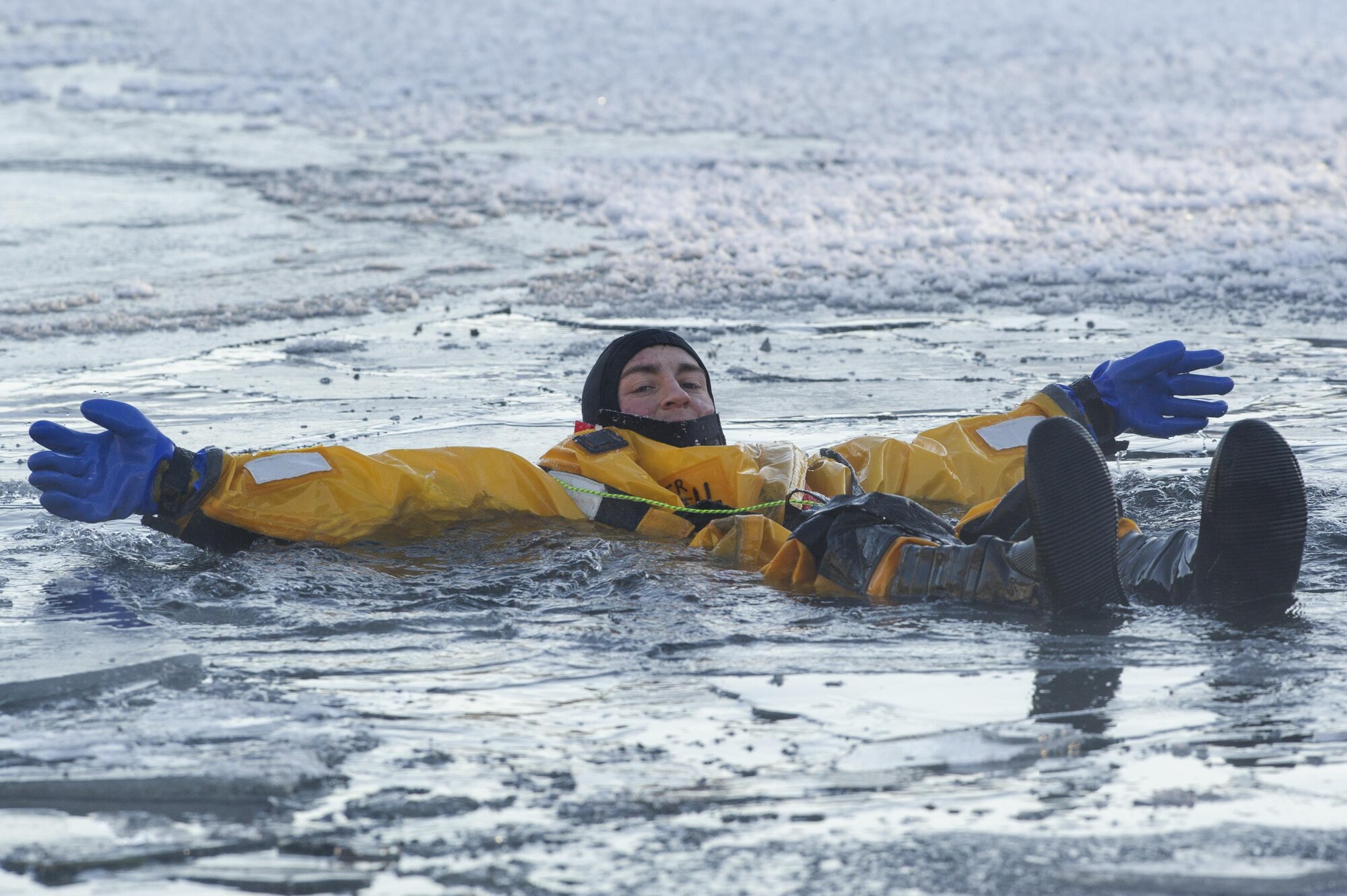 U.S. Air Force Airman 1st Class Joseph Humphrey, a fire protection specialist assigned to the 673rd Civil Engineer Squadron, simulates a cold water victim while conducting ice water rescue training at Joint Base Elmendorf-Richardson, Alaska Feb. 4, 2017. The training taught the JBER firefighters self-rescue techniques, victim recovery, and certified them as ice water rescue technicians. Humphrey is a native of Ridgecrest, Calif. (U.S. Air Force photo/Alejandro Pena)
