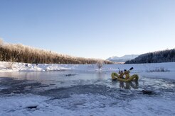 U.S. Air Force fire protection specialists, assigned to the 673rd Civil Engineer Squadron, conduct ice water rescue training at Joint Base Elmendorf-Richardson, Alaska Feb. 4, 2017. The training taught the JBER firefighters self-rescue techniques, victim recovery, and certified them as ice water rescue technicians. (U.S. Air Force photo/Alejandro Pena)