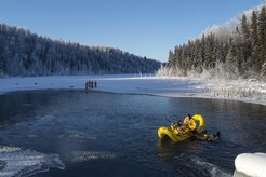 U.S. Air Force fire protection specialists, assigned to the 673rd Civil Engineer Squadron, conduct ice water rescue training at Joint Base Elmendorf-Richardson, Alaska Feb. 4, 2017. The training taught the JBER firefighters self-rescue techniques, victim recovery, and certified them as ice water rescue technicians. (U.S. Air Force photo/Alejandro Pena)
