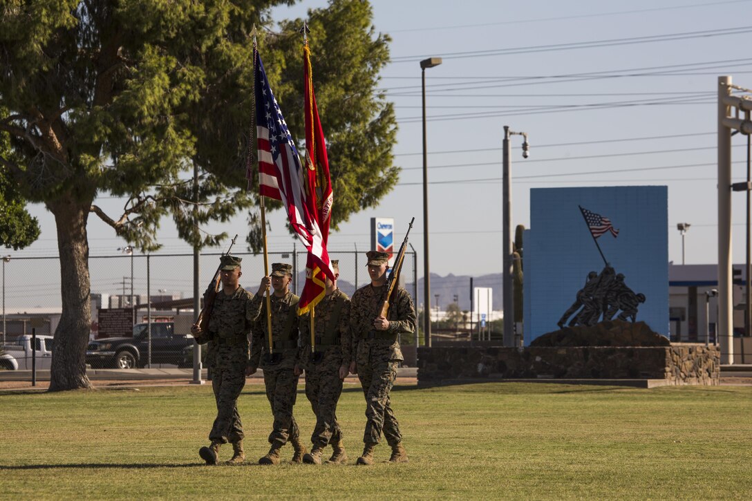 Headquarters and Headquarters Squadron’s color guard marches onto the parade field during the annual cake cutting ceremony and historical uniform pageant to celebrate the 241st Marine Corps birthday at Marine Corps Air Station Yuma, Ariz., Nov. 10, 2016. The uniform pageant and cake cutting ceremony are annual traditions held to celebrate the Marine Corps birthday, honor Marines of the past, present and future and signify the passing of traditions from one generation to the next. (U.S. Marine Corps photo by Lance Cpl. Christian Cachola/Released)