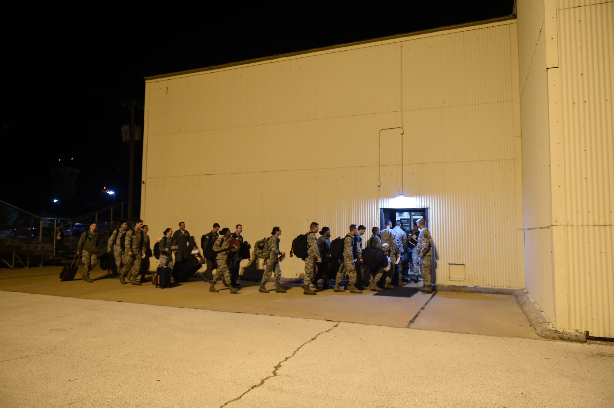 Airmen from the 9th Bomb Squadron, 7th Operations Support Squadron and the 7th Maintenance Group proceed through a deployment processing line at Dyess Air Force Base, Texas, Jan. 31, 2017. More than 300 personnel went through the line to have their bags weighed and inspected prior to their flight. (U.S. Air Force photo by Airman 1st Class Quay Drawdy)