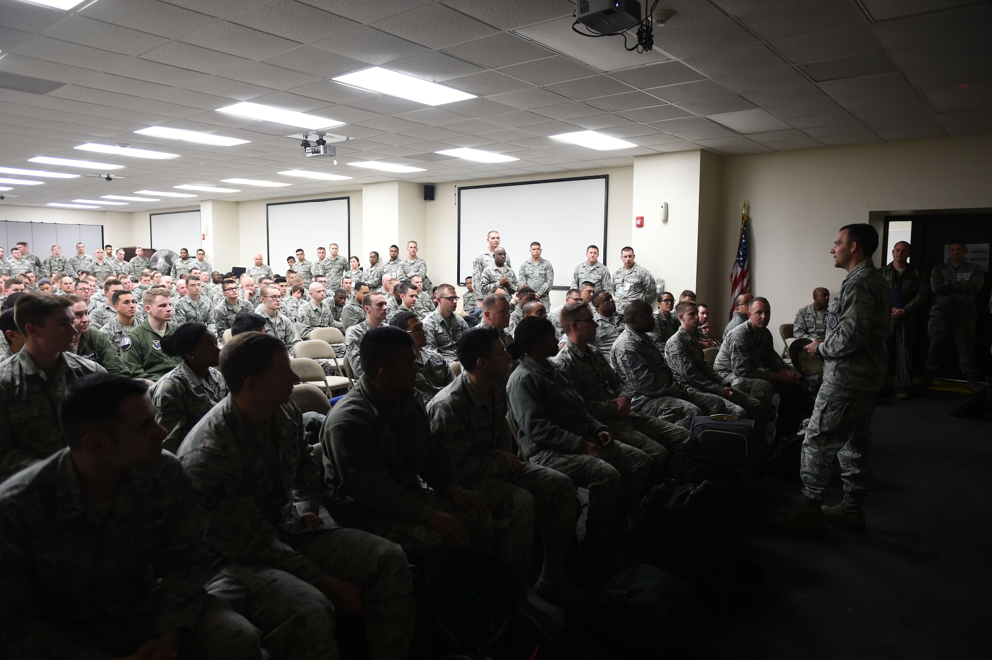 U.S. Air Force Col. David Benson, 7th Bomb Wing Commander, addresses expeditionary force deployers at Dyess Air Force Base, Texas, Jan. 31, 2017. Benson offered words of comfort and encouragement to more than 300 members of Dyess AFB before their deployment to Andersen Air Force Base, Guam. (U.S. Air Force photo by Airman 1st Class Quay Drawdy)