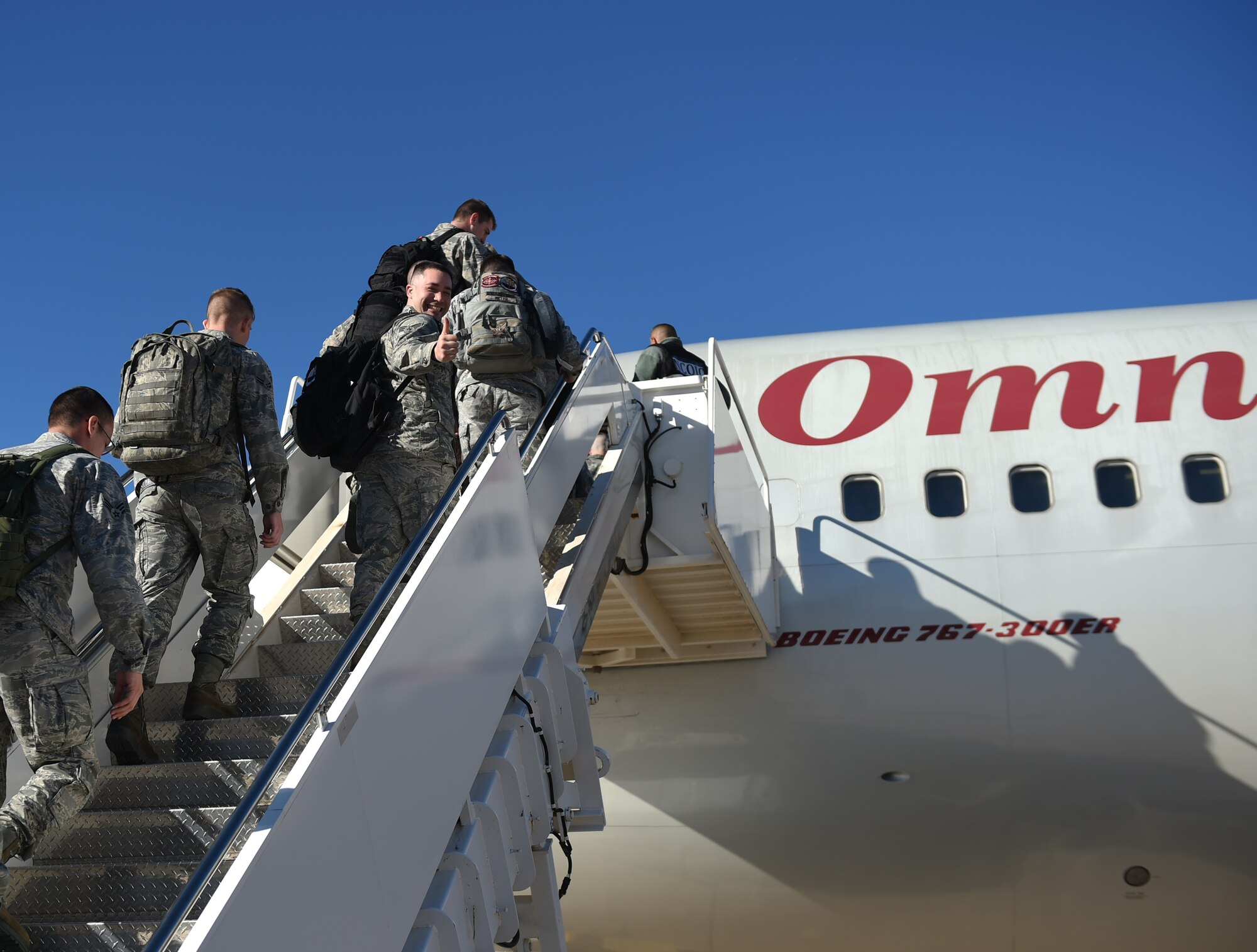 Airmen board a Boeing 767 at Dyess Air Force Base, Texas, Jan. 31, 2017. The 7th Maintenance Group, 7th Operations Support Squadron and 9th Bomb Squadron deployed more than 300 maintainers, support personnel and pilots to Andersen Air Force Base, Guam, as part of the continuous bomber presence mission in the Pacific Air Command area of responsibility. (U.S. Air Force photo by Airman 1st Class Quay Drawdy)
