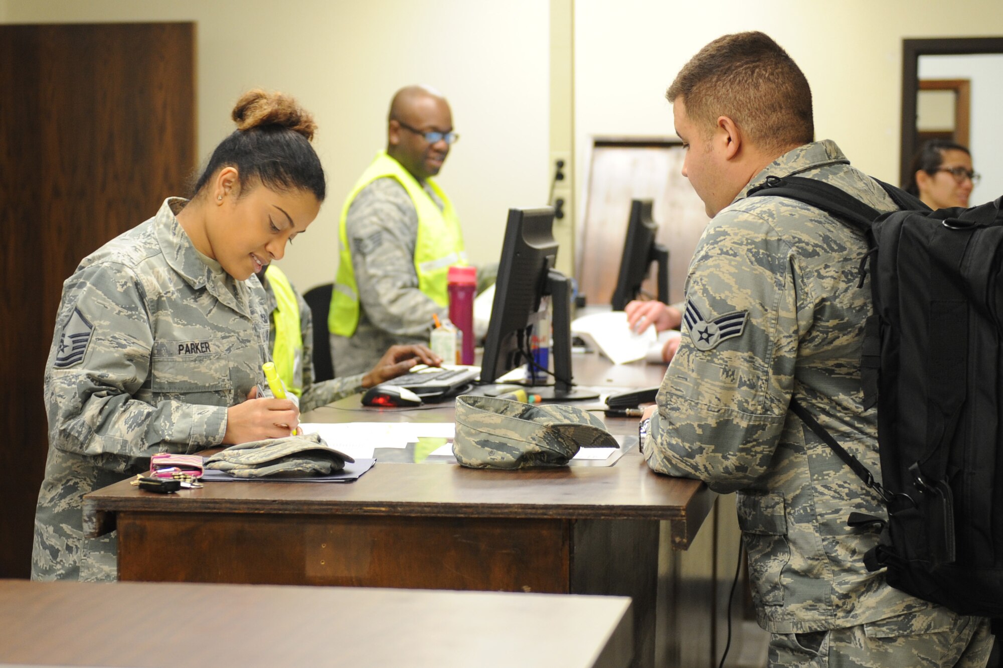 U.S. Air Force Master Sgt. Shobha Parker, 7th Logistics Readiness Squadron traffic management section chief, (left) processes Senior Airman Jose Martinez, 7th Logistics Readiness Squadron, for deployment at Dyess Air Force Base, Texas, Jan. 31, 2017. Dyess Airmen deployed to Andersen Air Force Base, Guam, to relieve the 34th Expeditionary Bomb Squadron from Ellsworth Air Force Base, S.D. (U.S. Air Force photo by Airman 1st Class Emily Copeland)