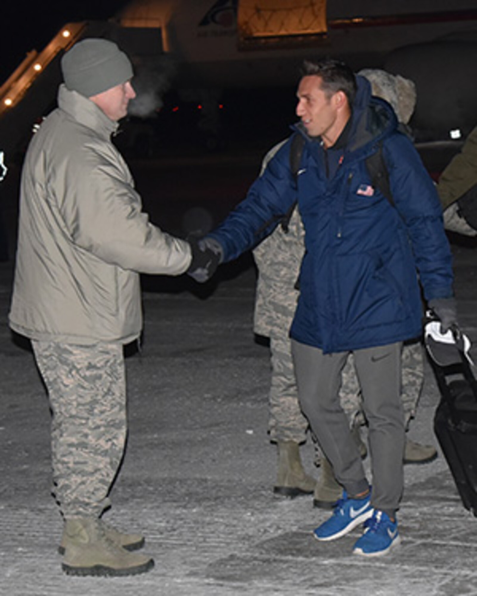 THULE AIR BASE, Greenland – Olympic silver medalist Sam Dorman greets Airmen of the 821st Air Base Group at Thule Air Base, Greenland, Jan. 21, 2017. Dorman visited the Top of the World with fellow Olympian Troy Dumais as part of the “Dive Into Service” program, which launched last year. (Courtesy photo)