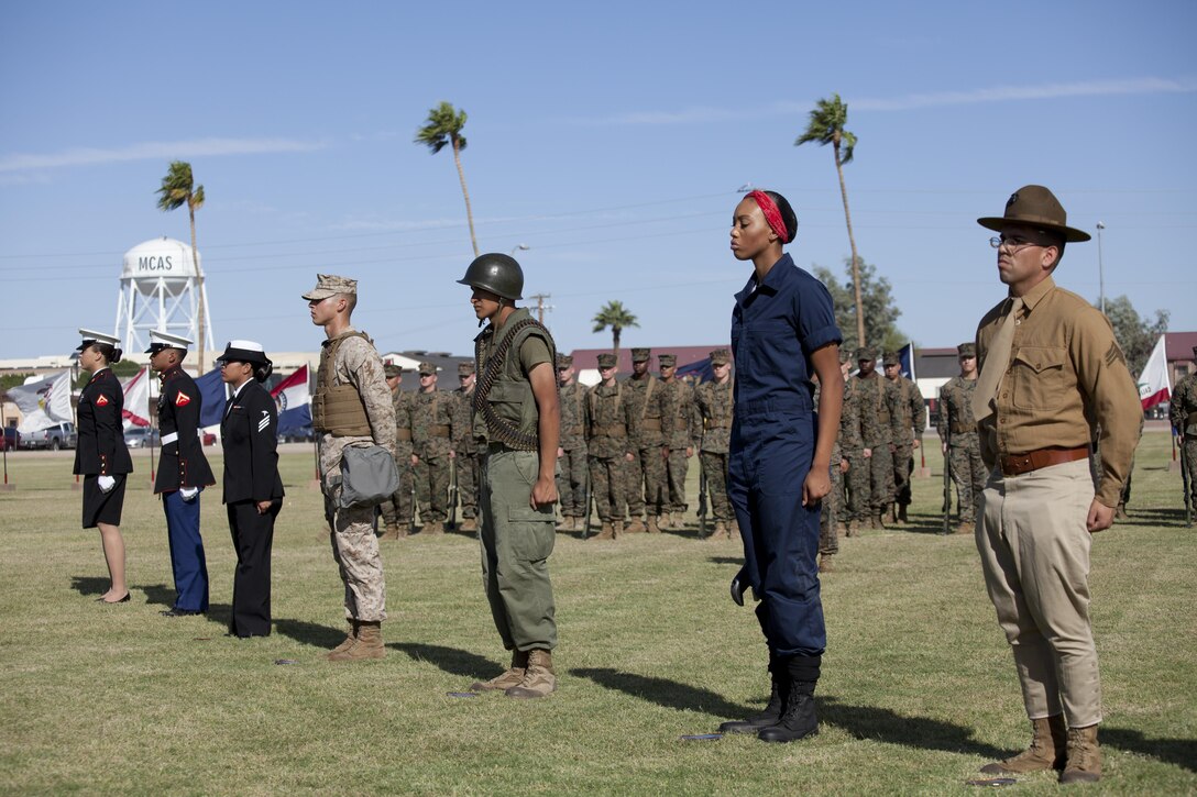 Marines with Headquarters and Headquarters Squadron participate in a historical uniform pageant at Marine Corps Air Station Yuma, Ariz., Nov. 10, 2016.  The ceremony celebrates the 241st birthday of the Marine Corps, and serves to honor Marines of the past, present and future while signifying the passing of traditions from one generation to the next. (U.S. Marine Corps photo by Lance Cpl. Joel Soriano/Released)