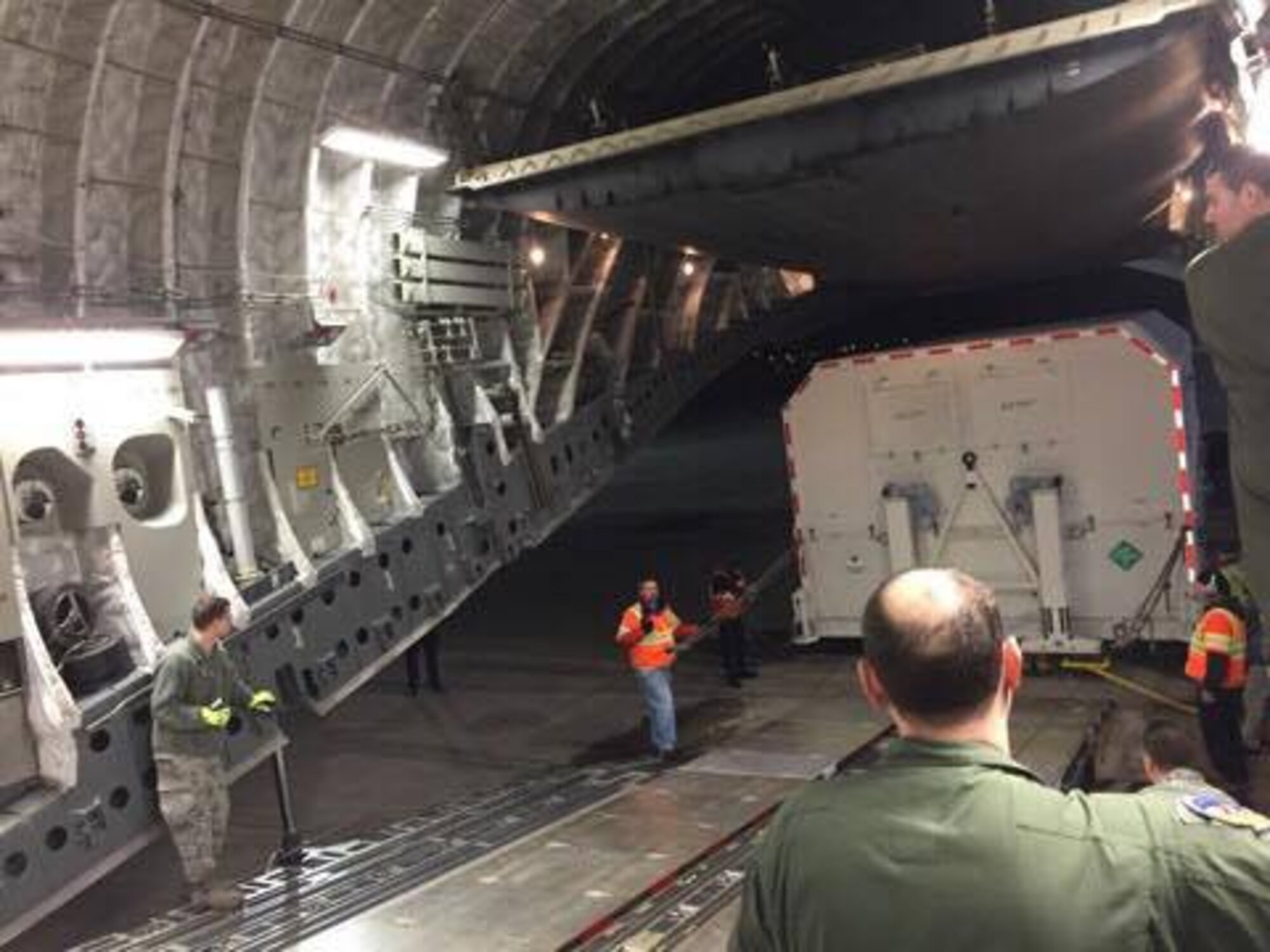 Personnel load a shipping container, with a GPS Block IIIA Satellite Pathfinder inside, onto a C-17 Globemaster III, operated by the 3d Airlift Squadron, Jan. 29, 2017, at Space Coast Regional Airport in Titusville, Fla. The GPS III is the next generation of Navstar GPS satellites built by Lockheed Martin Space Systems and operated by the Air Force. (Courtesy photo)