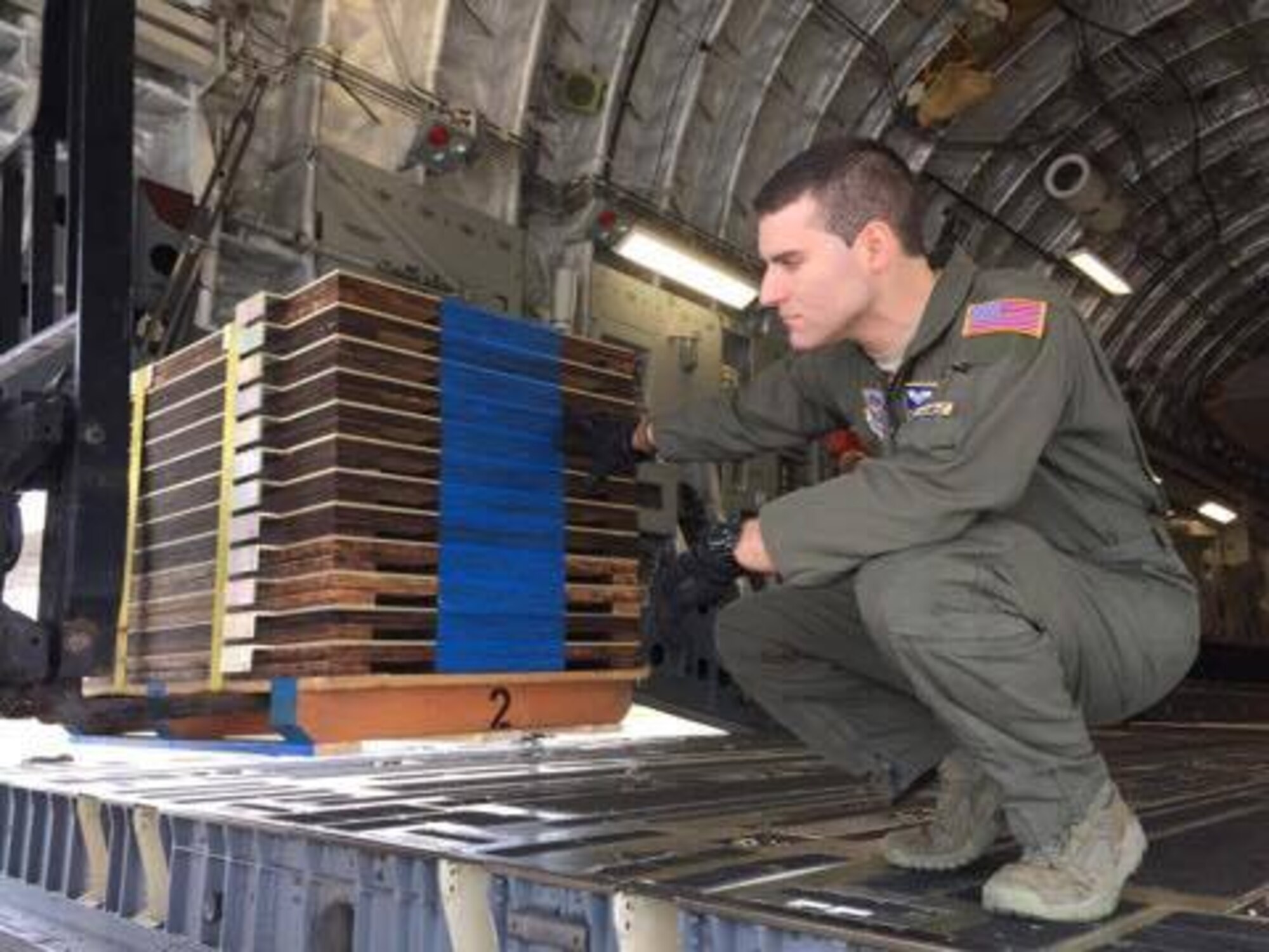 Senior Airman Mathew Snyder, 3d Airlift Squadron loadmaster, loads ramp shoring onto a C-17 Globemaster III Jan. 29, 2017, at Space Coast Regional Airport in Titusville, Fla. The cargo load required 7,000 pounds of shoring. (Courtesy photo) 