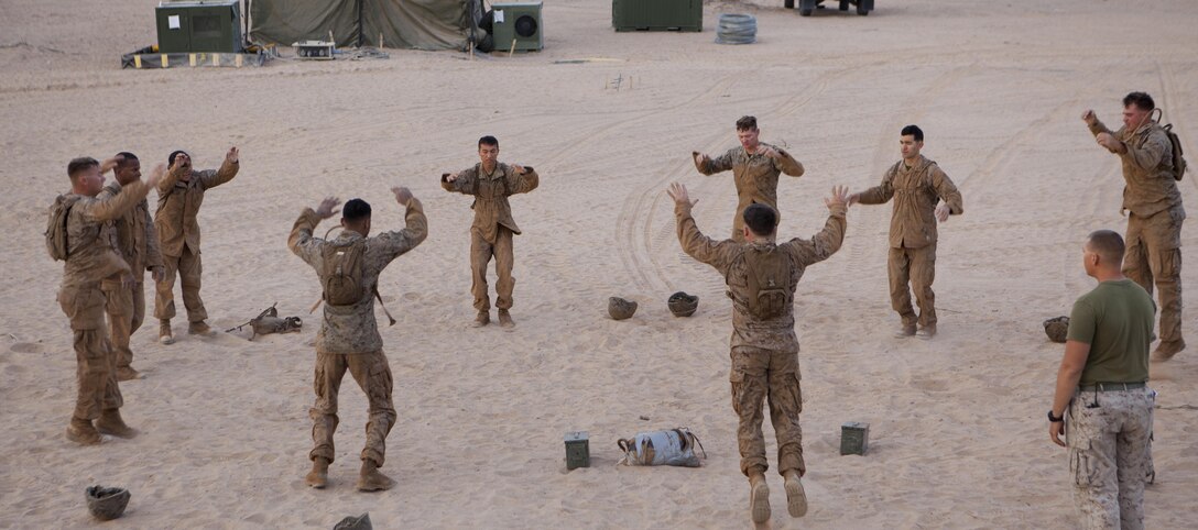 U.S. Marines with 8th Engineer Support Battalion conduct burpees as part of a squad competition at Canon Air Defense Complex, Yuma, Ariz., Oct. 24, 2016. Squad competitions happen among every squadron throughout the Marine Corps to build camaraderie and foster good-spirited competition between the separate elements that make up the unit. (U.S. Marine Corps photo taken by Cpl. Summer Romero/ Released)