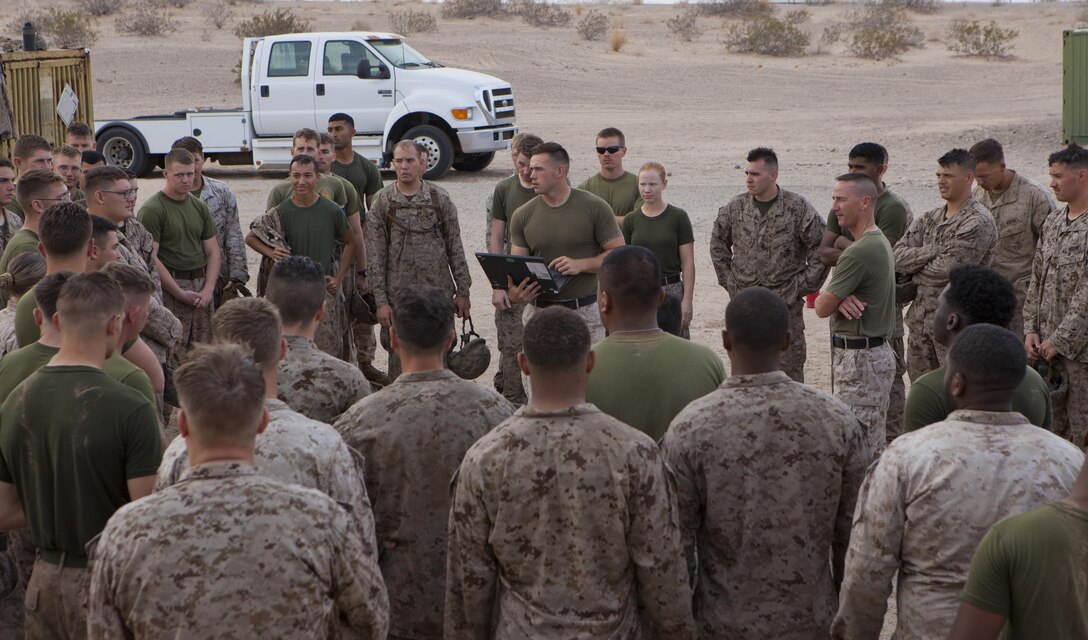 U.S. Marines with 8th Engineer Support Battalion gather together for a brief covering their squad competition at Canon Air Defense Complex, Yuma, Ariz., Oct. 24, 2016. Squad competitions happen among every squadron throughout the Marine Corps to build camaraderie and foster good-spirited competition between the separate elements that make up the unit. (U.S. Marine Corps photo taken by Cpl. Summer Romero/ Released)