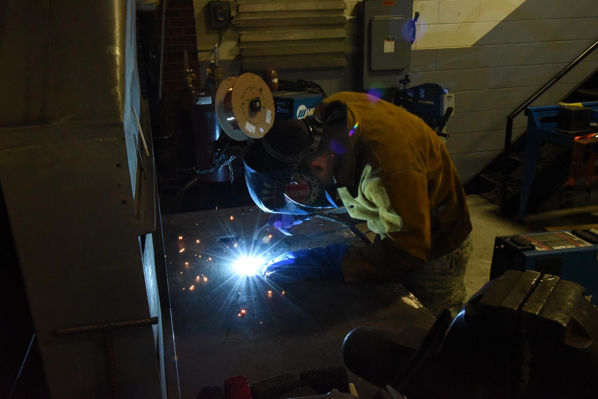 PETERSON AIR FORCE BASE, Colo. – Staff Sgt. Alexander Krussell, 21st Civil Engineer Squadron, structural craftsman, demonstrates metal inert gas welding at Peterson Air Force Base, Jan. 26 2017. Krussell is just one of 19 Airmen assigned to the structural shop. (U.S. Air Force photo by Philip Carter)