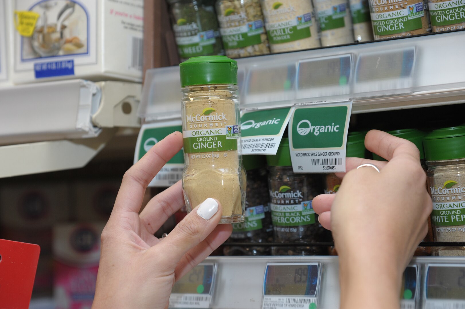 Claudia Smith, commissary manager, reads the guide label on can goods, during the Go for Green program at Joint Base San Antonio-Randolph. Feb. 2, 2017.  Go for Green is a nutritional recognition labeling system providing a quick assessment of the nutritional value of menu offerings and food products.  