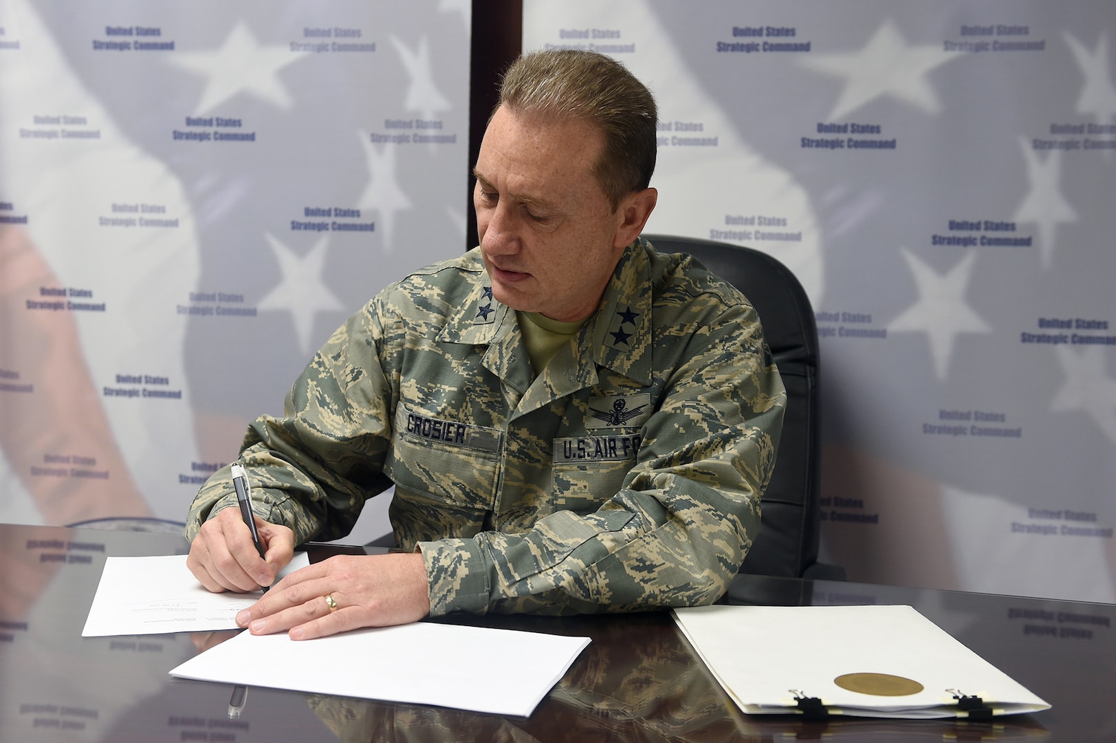 U.S. Air Force Maj. Gen. Clinton E. Crosier, U.S. Strategic Command (USSTRATCOM) director of plans and policy, signs a memorandum of understanding (MOU) at USSTRATCOM headquarters, Feb. 7, 2017, to share space situational awareness (SSA) services and information with the Belgium Federal Science Policy Office. The MOU – also signed by Ms. Elke Sleurs, Belgium’s secretary of state for science policy, in Brussels, Jan. 31, 2017 – will enhance awareness within the space domain and increase the safety of spaceflight operations for the U.S. and Belgium. Belgium joins 11 nations (the United Kingdom, the Republic of Korea, France, Canada, Italy, Japan, Israel, Spain, Germany, Australia and the United Arab Emirates), two intergovernmental organizations (the European Space Agency and the European Organization for the Exploitation of Meteorological Satellites) and more than 50 commercial satellite owner/operator/launchers already participating in SSA data-sharing agreements with USSTRATCOM. SSA data-sharing agreements enhance multinational space cooperation and streamline the process for USSTRATCOM partners to request specific information gathered by USSTRATCOM’s Joint Space Operations Center at Vandenberg Air Force Base, Calif. 