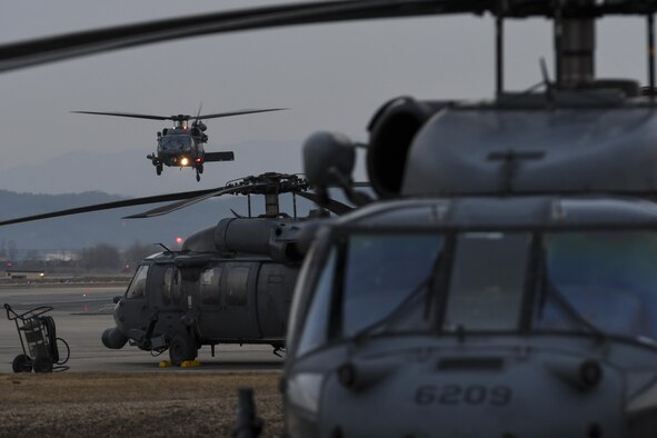 U.S. Air Force HH-60 Pave Hawks assigned to the 33rd Rescue Squadron (RQS) from Kadena Air Base, Japan, prepare for training missions at Osan Air Base, Republic of Korea (ROK) in support of Exercise Pacific Thunder 17-1, Feb. 2, 2017. The two-week long exercise is designed to train aircrews and commanders to validate tactics, techniques and procedures used for combat search and rescue and suppression of enemy air defense.  (U.S. Air Force photo by Staff Sgt. Victor J. Caputo)