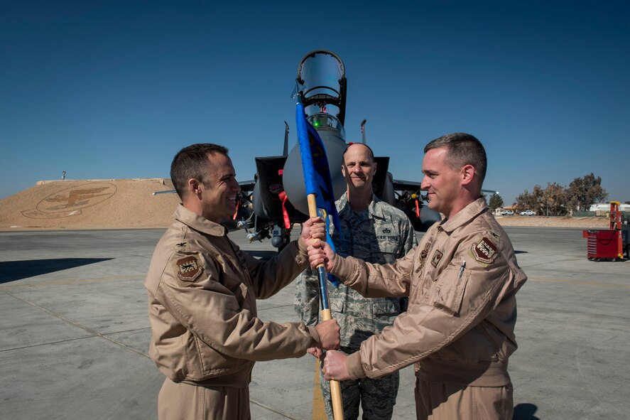 U.S.  Air Force Col. Thomas Palmer takes command of the 332nd Expeditionary Operations wing from U.S.  Air Force Col. Clinton Eichelberger, 332nd Air Expeditionary Wing commander during a change of command ceremony Feb. 2, 2017. (U.S. Air Force photo by Staff Sgt. Eboni Reams)