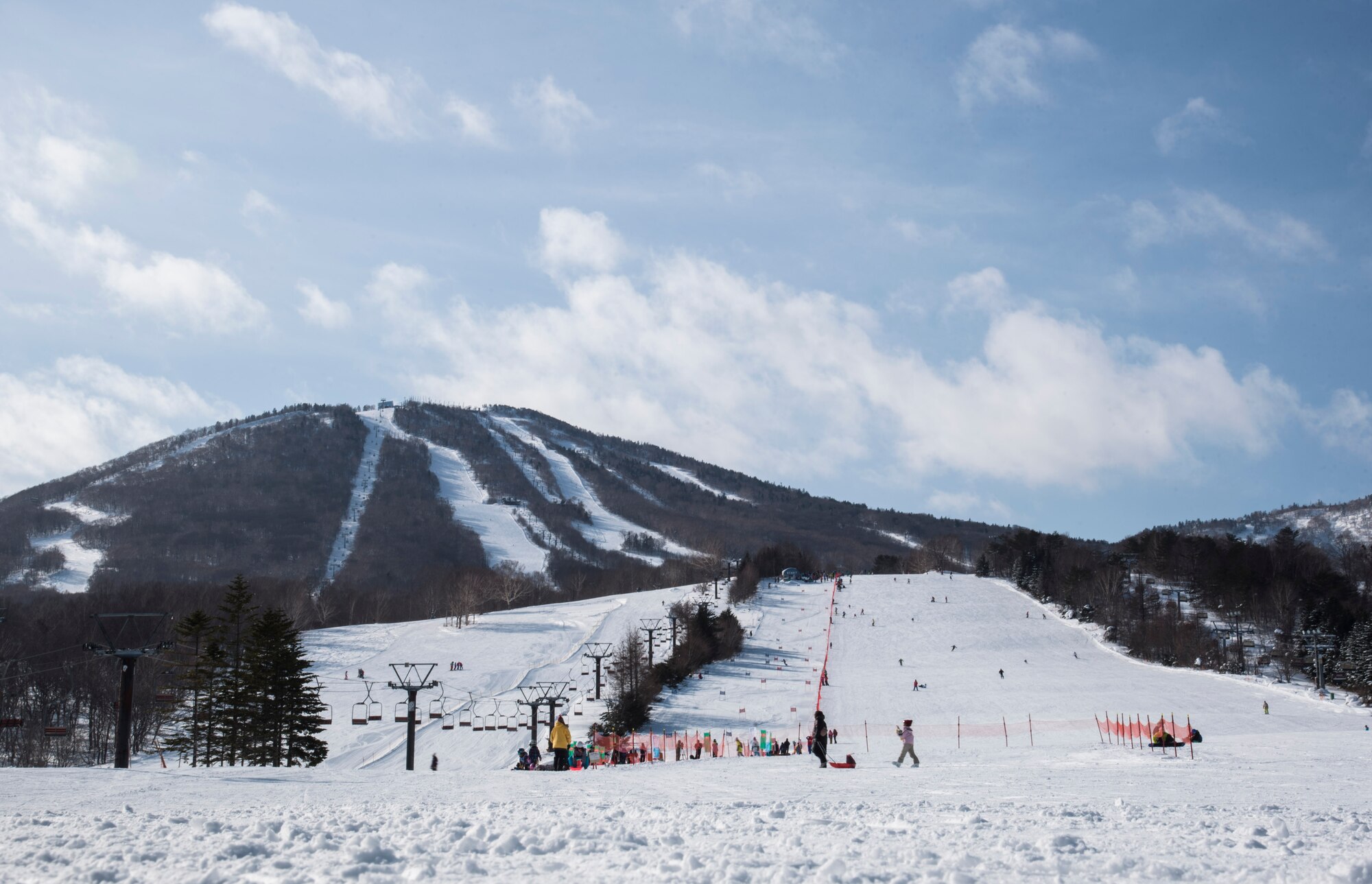 Skiers prepare to ride a lift at a ski resort in Hachimantai, Japan, Jan. 29, 2017. Misawa Air Base's chaplain corps provided an opportunity for Airmen to exercise their resiliency tools during a ski trip. (U.S. Air Force photo by Airman 1st Class Sadie Colbert)