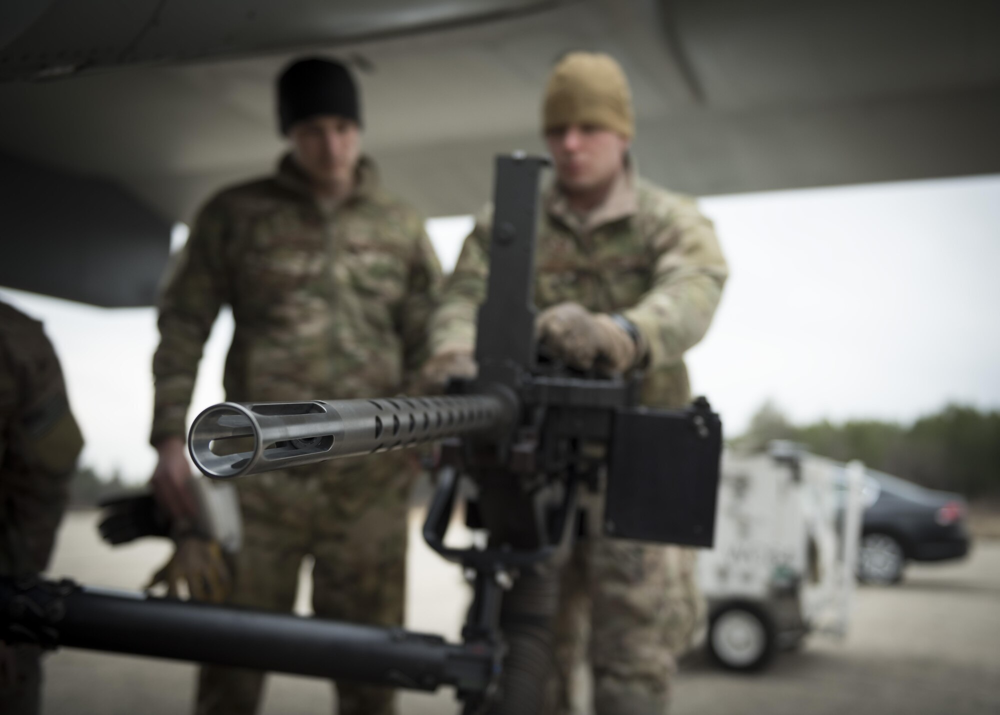U.S. special-mission aviators assigned to the 7th Special Operations Squadron perform pre-flight checks on a CV-22 Osprey .50-caliber GAU-21 heavy machine gun Jan. 31, 2017, on Zadar Air Base, Croatia. Traveling to Slunj Range, part of the country’s Multi-national Aviation Training Complex, allowed these aircrew members to train on the ramp mounted weapon system and work with Croatian Joint Terminal Attack Controllers on the ground, increasing interoperability. (U.S. Air Force photo/1st Lt. Chris Sullivan)