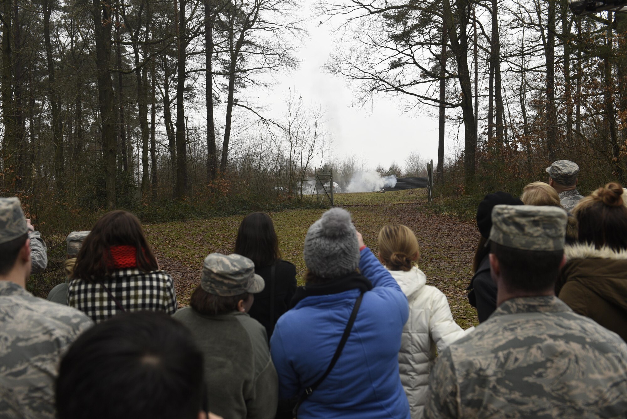 Annual award nominees watch a controlled detonation by Airmen of the 52nd Civil Engineer Squadron explosive ordnance disposal on Spangdahlem Air Base, Germany, Feb. 2, 2017. The nominees were given a base tour which included the fire department, military working dogs and EOD. (U.S. Air Force photo by Staff Sgt. Jonathan Snyder)