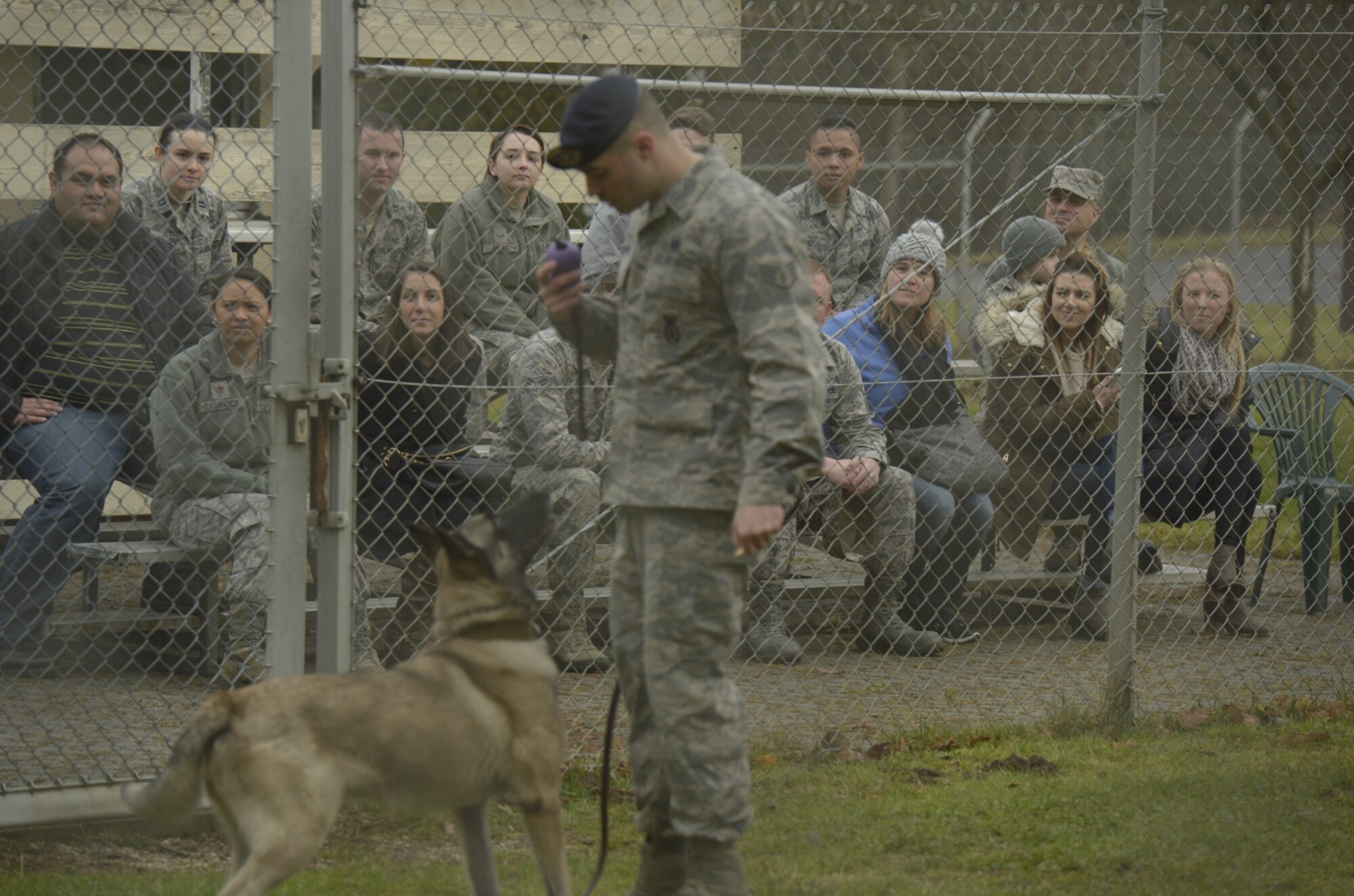 Annual award nominees watch a demonstration by Staff Sgt. Anthony Mason, 52nd Security Forces Squadron military working dog handler, on Spangdahlem Air Base, Germany, Feb. 2, 2017. The nominees were given a base tour which included the fire department, MWD and explosive ordnance disposal. (U.S. Air Force photo by Staff Sgt. Jonathan Snyder)