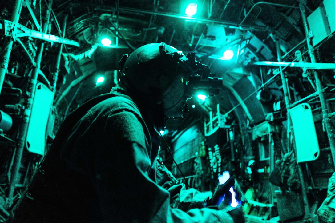 Air Force Tech. Sgt. Nathan Schultz prepares to secure cargo inside a C-130H Hercules aircraft at Qayyarah Airfield West, Iraq, Feb. 3, 2017. Shultz is a loadmaster assigned to the Montana’s Air National Guard’s 737th Expeditionary Airlift Squadron. Air Force photo by Senior Airman Jordan Castelan