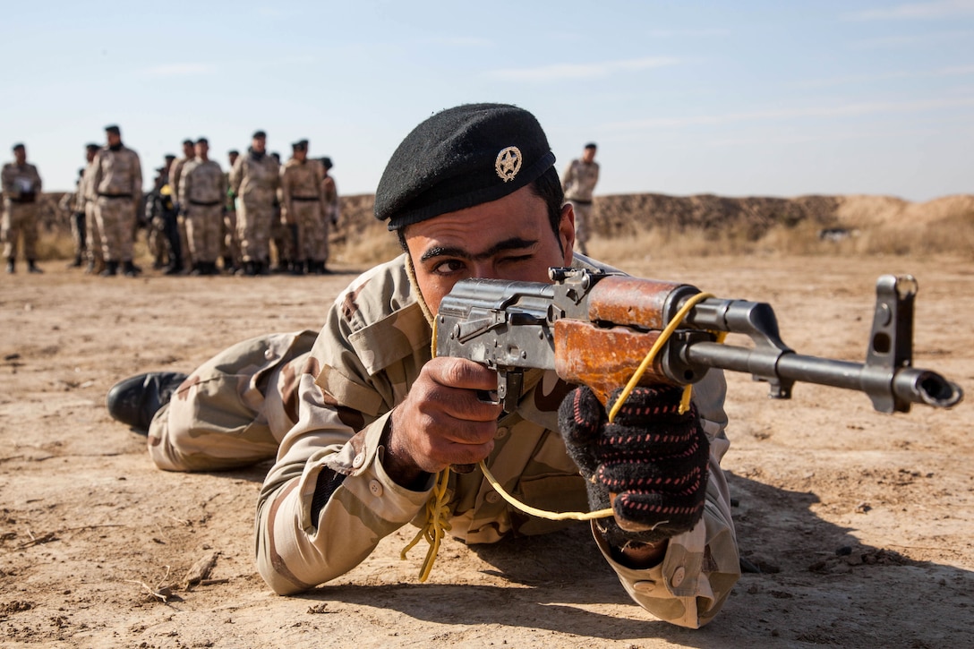 An Iraqi security forces soldier practices a prone shooting position at Besmaya Range Complex, Iraq, Feb. 1, 2017. Training at building partner capacity sites is an integral part of Combined Joint Task Force – Operation Inherent Resolve’s global Coalition effort to train Iraqi security forces personnel to defeat ISIL. CJTF-OIR is the global Coalition to defeat ISIL in Iraq and Syria. (U.S. Army photo by Sgt. Joshua Wooten)