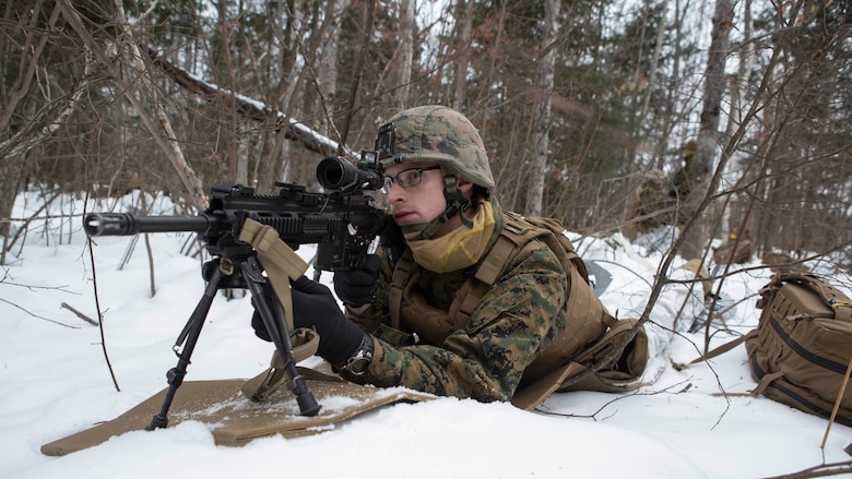 Lance Cpl. Dan Kennedy, a rifleman with Company C, 1st Battalion, 25th Marine Regiment, 4th Marine Division, sets up 360-degree security during exercise Riley Xanten II, in Burwash, Ontario, Feb. 3-5, 2017. During the exercise, the Marines joined soldiers from the Canadian Armed Forces to exchange knowledge and increase proficiency in cold weather tactics, survival skills, shelter building, ice fishing, and more. 