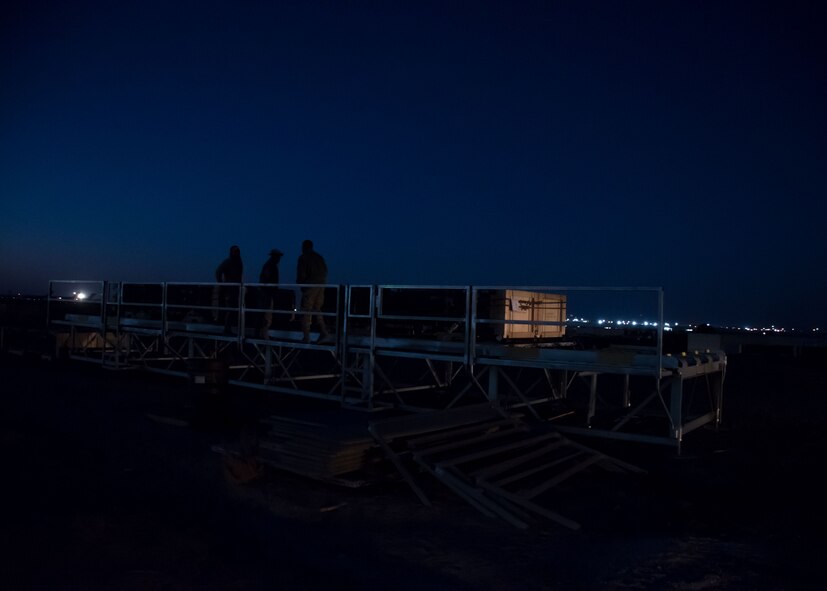 A group of 386th Expeditionary Logistics Readiness Squadron aerial porters prepares a pallet of rockets for transport to a C-130H Hercules at an undisclosed location in Southwest Asia, Feb. 2, 2017. The rockets are for High Mobility Artillery Rocket Systems used in the fight against ISIL. (U.S. Air Force photo/Senior Airman Andrew Park)