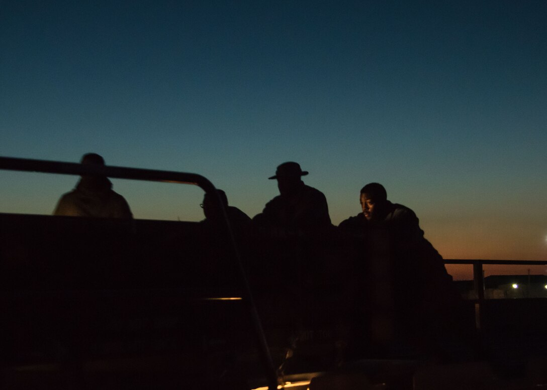 A group of 386th Expeditionary Logistics Readiness Squadron aerial porters push a pallet of rockets onto a K-loader at an undisclosed location in Southwest Asia, Feb. 2, 2017. The rockets are for High Mobility Artillery Rocket Systems used in the fight against ISIL. (U.S. Air Force photo/Senior Airman Andrew Park)