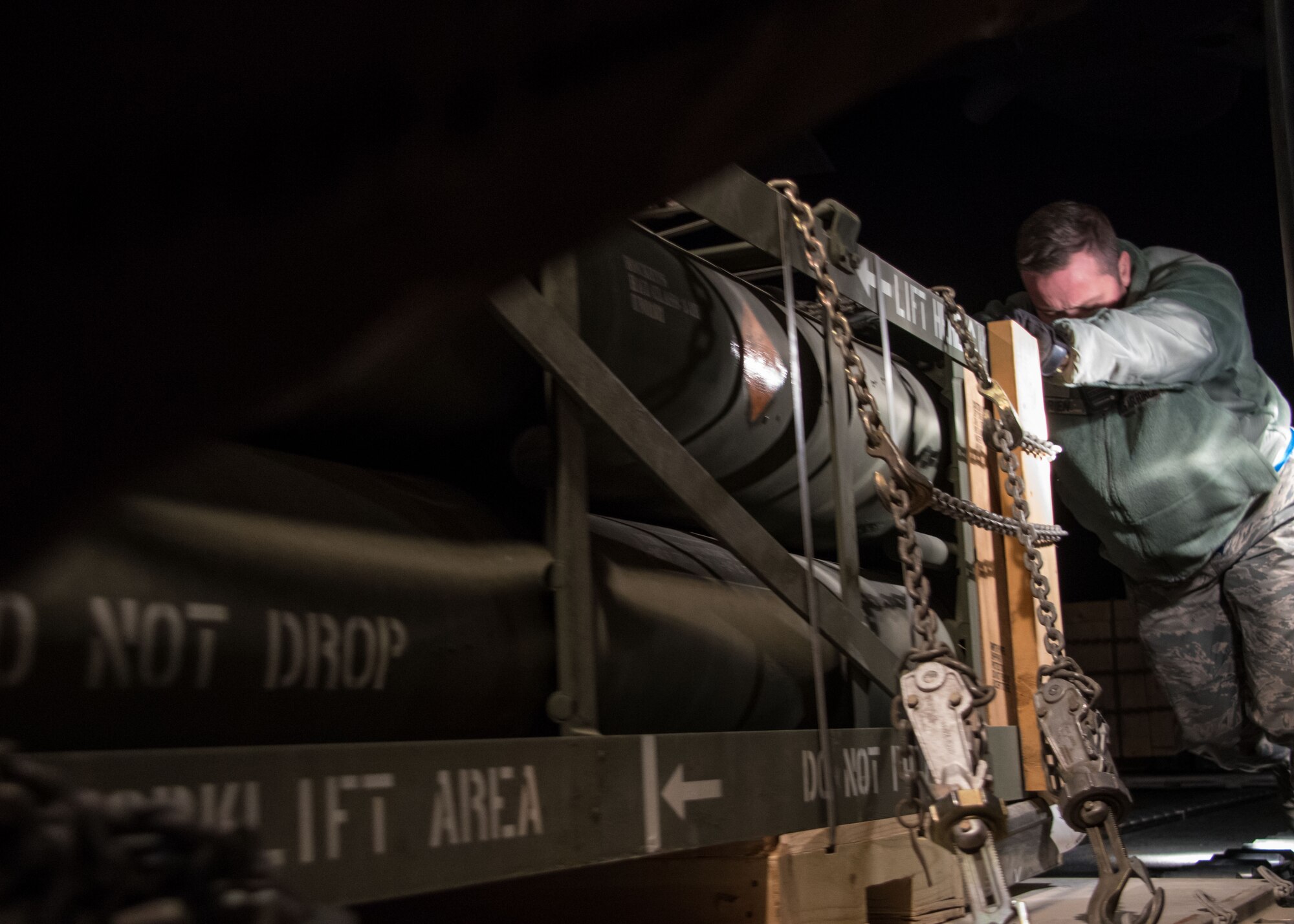 A 386th Expeditionary Logistics Readiness Squadron aerial porter pushes a pallet of rockets into the cargo area of a C-130H Hercules at an undisclosed location in Southwest Asia, Feb. 3, 2017. The aerial porters work with loadmasters to ensure the weight of the cargo is properly distributed to not affect the aircraft’s flight. (U.S. Air Force photo/Senior Airman Andrew Park)