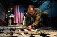 Senior Airman Creg Dubois, a 737th Expeditionary Airlift Squadron loadmaster, secures cargo before take-off inside a C-130H Hercules at an undisclosed location in Southwest Asia, Feb. 3, 2017. Dubois is part of a team that delivered 30,000 pounds of cargo to aide in the fight against the Islamic State of Iraq and the Levant. (U.S. Air Force photo/Senior Airman Jordan Castelan)