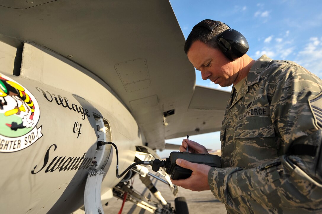 U.S. Air Force Master Sgt. Jody Smith, a flight line avionics technician assigned to the 180th Fighter Wing, Ohio Air National Guard, loads data in an F-16 Fighting Falcon prior to takeoff so the pilot can communicate securely with other pilots during a training exercise at MacDill Air Force Base in Tampa, Florida on Feb. 2, 2017. The 180th brought F-16s and more than 150 maintainers, pilots, and operations support personnel to MacDill AFB for a two-week training exercise which included basic fighter maneuvers against F-18 Hornets from the Canadian 425th Tactical Fighter Squadron, sharpening the combat capabilities of 180FW Airmen. (U.S. Air National Guard photo by Tech. Sgt. Nic Kuetemeyer)