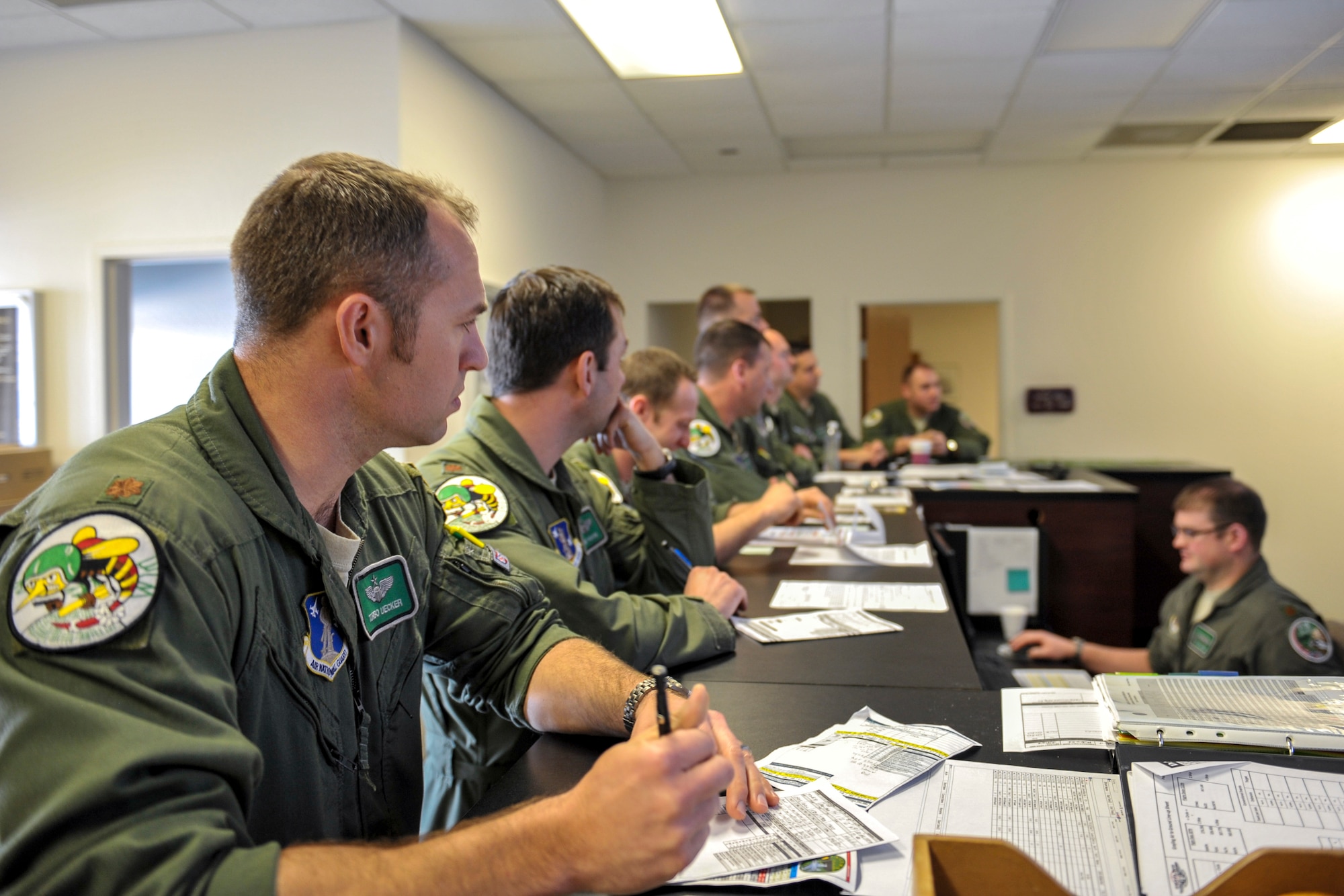 F-16 pilots assigned to the 180th Fighter Wing, Ohio Air National Guard, attend a pre-flight briefing to discuss flight plans and weather patterns during a training exercise at MacDill Air Force Base in Tampa, Florida on Feb. 2, 2017. The 180th brought their F-16s and approximately 150 maintainers, pilots, and operations specialists to MacDill AFB for a two week training exercise which included basic fighter maneuvers against F-18 Hornets from the Canadian 425th Tactical Fighter Squadron, sharpening the combat capabilities of the OANG Airmen. (Air National Guard photo by Tech. Sgt. Nic Kuetemeyer)