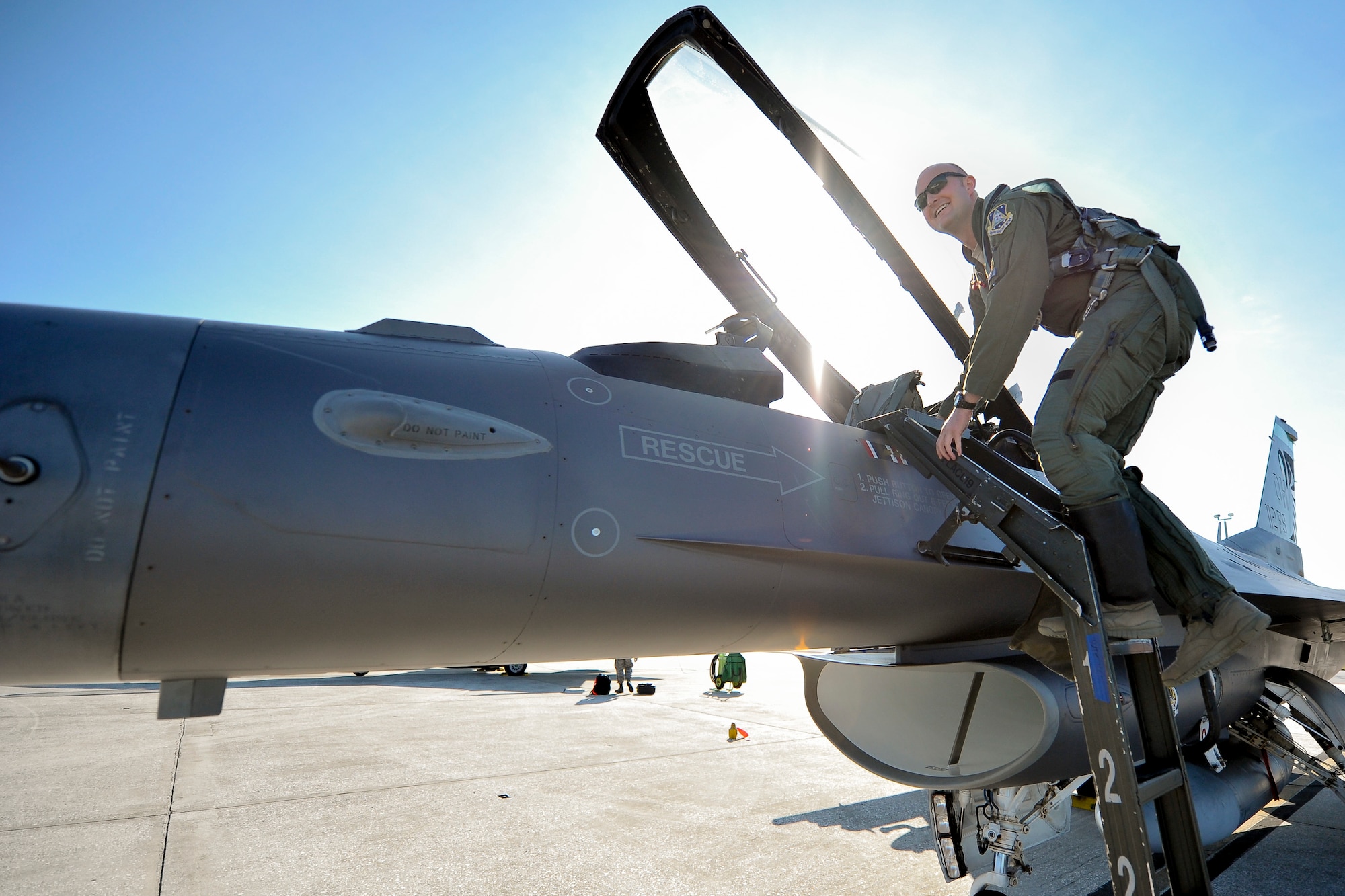 U.S. Air Force Capt. Seth Murray, F-16 pilot assigned to the 180th Fighter Wing, Ohio Air National Guard, climbs in to the cockpit of an F-16 Fighting Falcon, ready to join in the “fight” during a training exercise at MacDill Air Force Base in Tampa, Florida on Feb. 2, 2017. The 180th brought their F-16s and approximately 150 maintainers, pilots, and operations specialists to MacDill AFB for a two week training exercise which included basic fighter maneuvers against F-18 Hornets from the Canadian 425th Tactical Fighter Squadron, sharpening the combat capabilities of the OANG Airmen. (Air National Guard photo by Tech. Sgt. Nic Kuetemeyer)