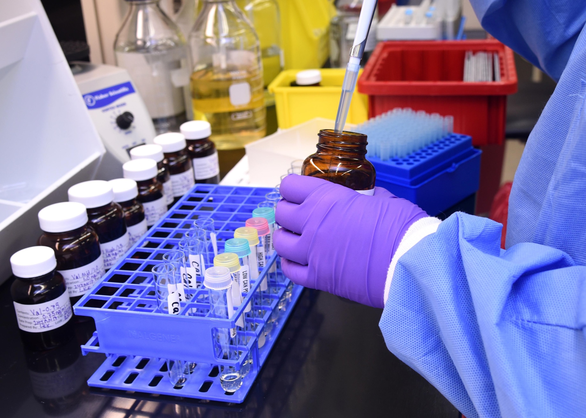 Kimberly Heine, Armed Forces Medical Examiner System Division of Forensic Toxicology analytical toxicologist, pipettes validation standards Jan. 24, 2017, at AFMES on Dover Air Force Base, Delaware.  The Special Forensic Toxicology Drug Testing Laboratory needs to validate methods in order to ensure the method they want to use is suitable for the analytes they want to detect on the instrument. (U.S. Air Force photo by Senior Airman Ashlin Federick)