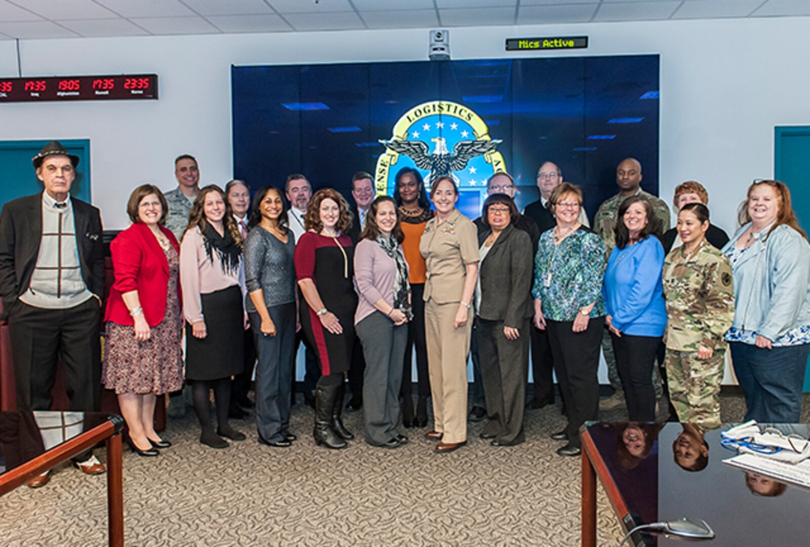 (Center) Land and Maritime Commander, Rear Admiral Michelle Skubic, is flanked by CFC team captains during a celebration event highlighting the campaign’s close out. The campaign raised more than $958,000 in contributions.