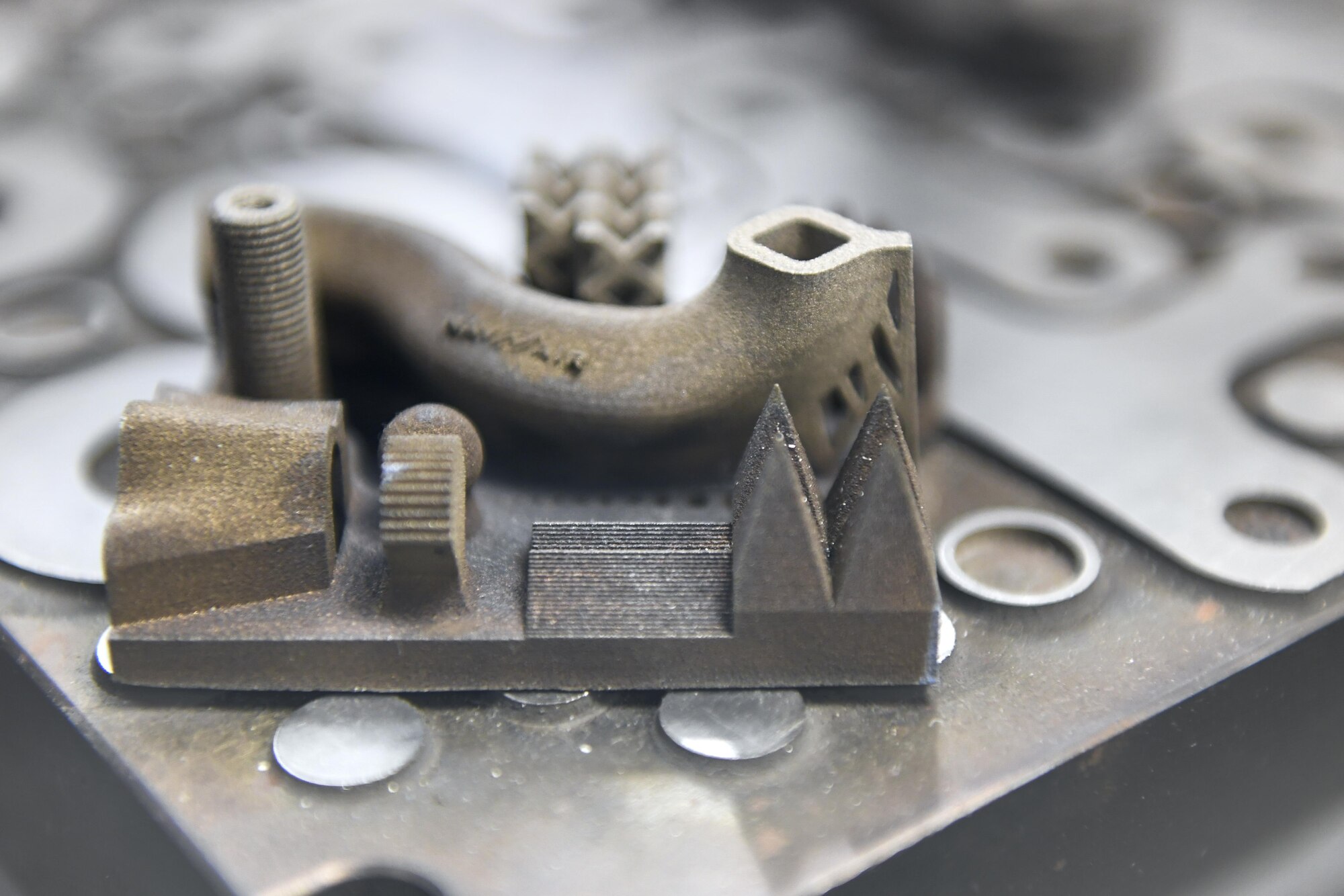 Engineers at NAWCAD Lakehurst utilize a 3-D printer to create complex geometrical shapes at Joint Base McGuire-Dix-Lakehurst, New Jersey, Feb. 8, 2017. This particular piece was designed by the engineers in order to demonstrate some of the capabilities of the 3-D printing machine. 