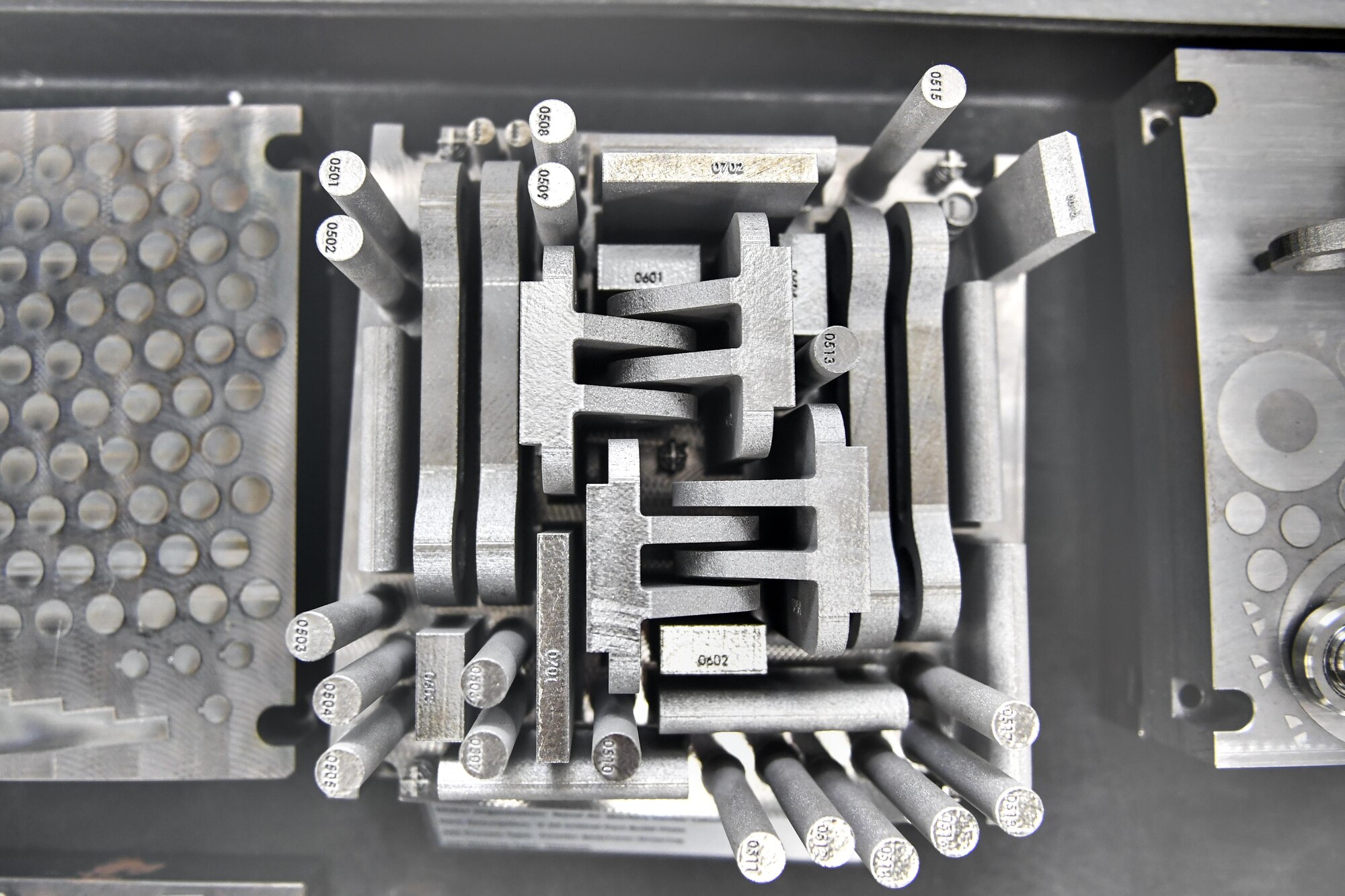 Engineers at NAWCAD Lakehurst utilize a 3-D printer to demonstrate their ability to create V-22 Osprey aircraft parts at Joint Base McGuire-Dix-Lakehurst, New Jersey, Feb. 8, 2017. The printer creates parts by fusing metallic powder, starting from the base of the structure up, working layer by layer. 