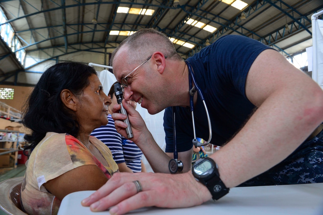 PUERTO BARRIOS, Guatemala (Feb. 4, 2017) -- Cmdr. Michael Arnold, a native of Chelmsford, Mass., and family medicine doctor assigned to Naval Hospital Jacksonville, Fla., examines a host nation patient at the Continuing Promise 2017 (CP-17) medical site in Puerto Barrios, Guatemala. CP-17 is a U.S. Southern Command-sponsored and U.S. Naval Forces Southern Command/U.S. 4th Fleet-conducted deployment to conduct civil-military operations including humanitarian assistance, training engagements, and medical, dental, and veterinary support in an effort to show U.S. support and commitment to Central and South America. (U.S. Navy Combat Camera photo by Petty Officer 2nd Class Brittney Cannady)