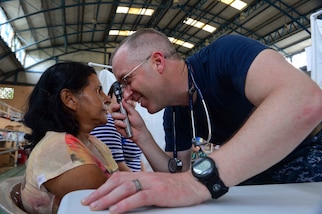 PUERTO BARRIOS, Guatemala (Feb. 4, 2017) -- Cmdr. Michael Arnold, a native of Chelmsford, Mass., and family medicine doctor assigned to Naval Hospital Jacksonville, Fla., examines a host nation patient at the Continuing Promise 2017 (CP-17) medical site in Puerto Barrios, Guatemala. CP-17 is a U.S. Southern Command-sponsored and U.S. Naval Forces Southern Command/U.S. 4th Fleet-conducted deployment to conduct civil-military operations including humanitarian assistance, training engagements, and medical, dental, and veterinary support in an effort to show U.S. support and commitment to Central and South America. (U.S. Navy Combat Camera photo by Petty Officer 2nd Class Brittney Cannady)